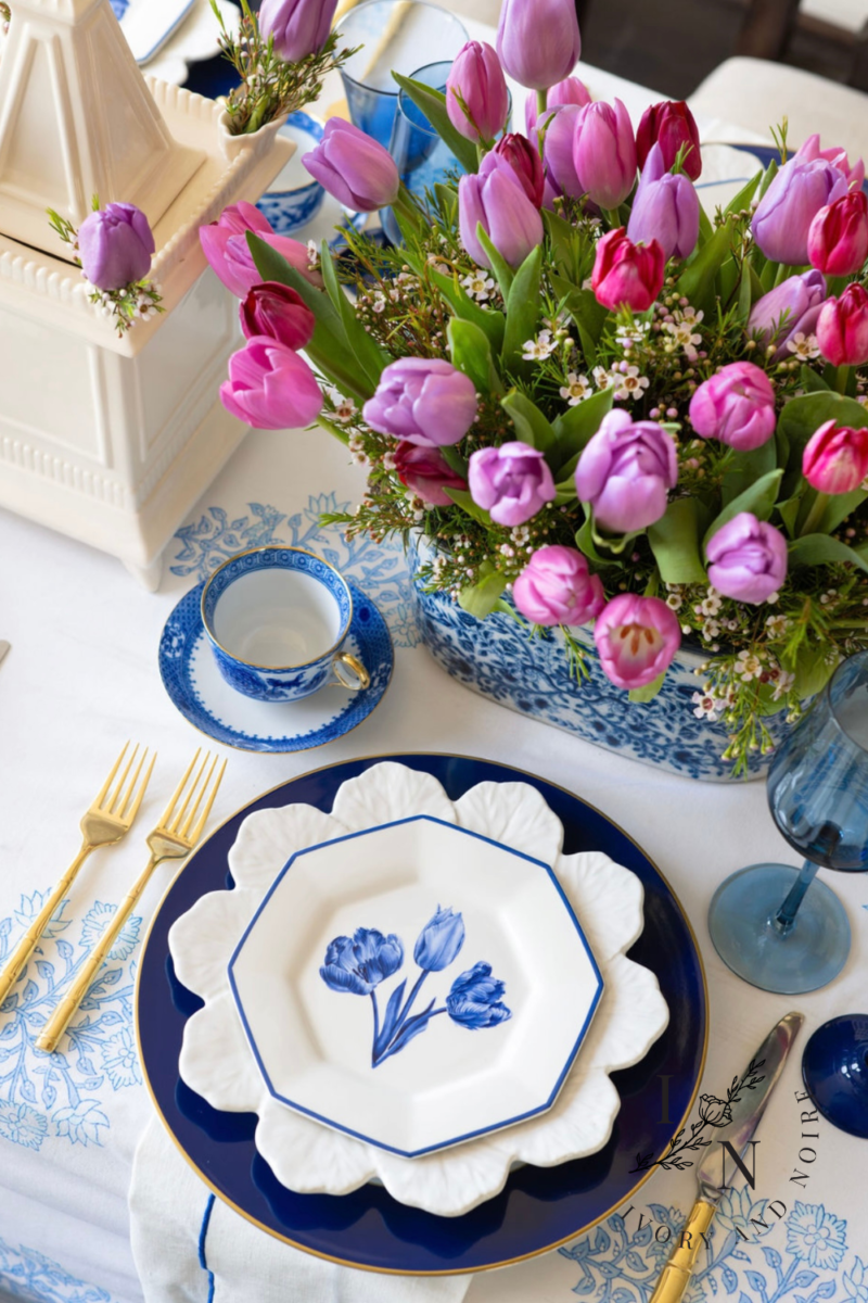 spring flower tablescape with tulips and blue and white theme